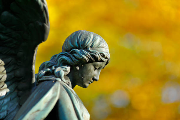 istock Antique Angel statue in a Cemetery 1350061296