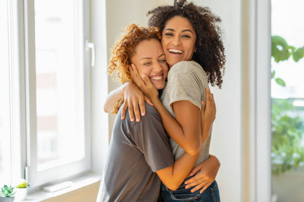 istock Happy girlfriends in a tender moment at home 1350062092