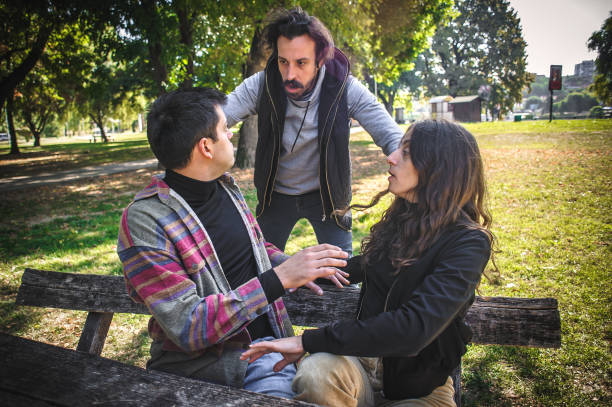 istock Adultery and infidelity. Girlfriend cheating his jealous boyfriend. Relationship polygamy 1350063017