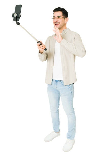 istock Full length of a man doing a live stream 1350063856