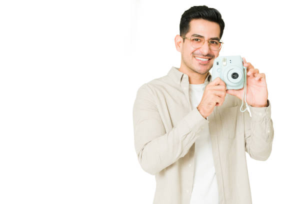 istock Young man buying a new camera 1350063868