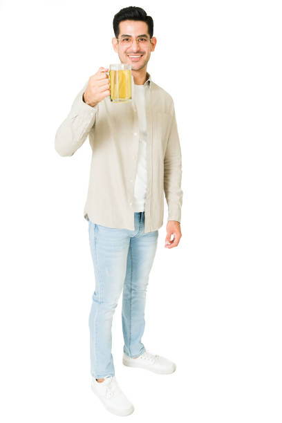 istock Hispanic man relaxing with a beer 1350064023