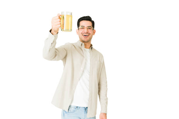 istock Happy man celebrating with a beer 1350064025