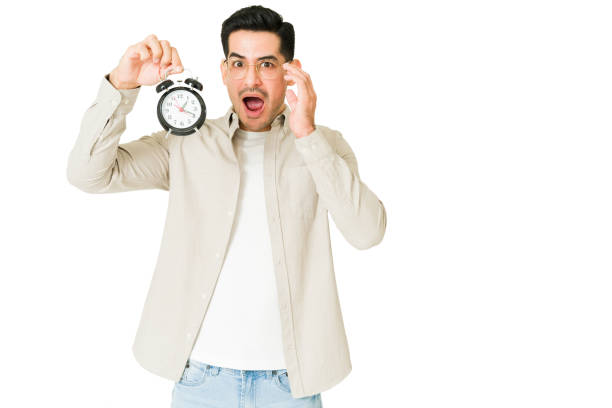 istock Stressed man showing the late hour 1350064061