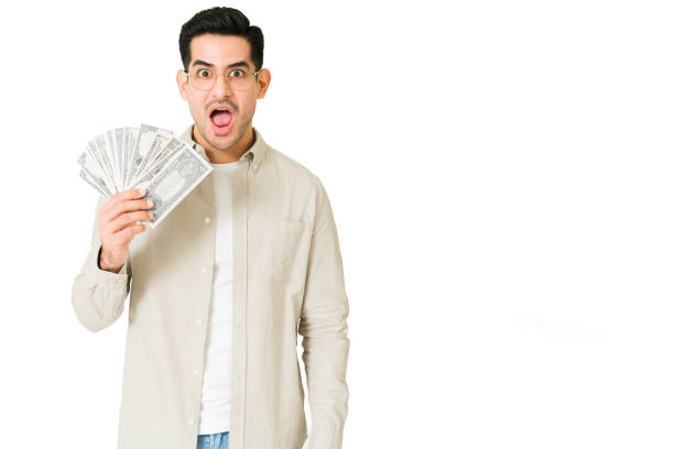 istock Lucky young man spending money 1350064083