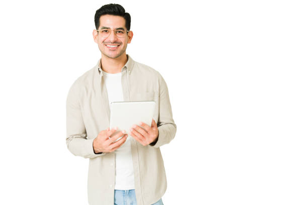 istock Young man watching videos on a tablet 1350064136