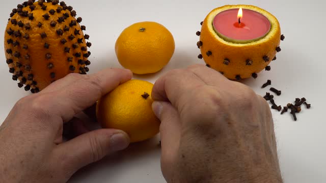 Making a spiced orange pomander balls  in a modern style