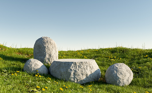 stone product display stand in a green meadow with flowers and clear sky. 3d rendering