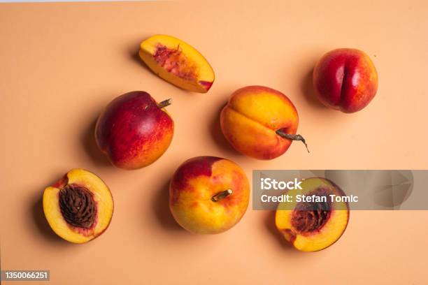 Ripe Organic Peaches On A Light Pink Background Top View Stock Photo - Download Image Now