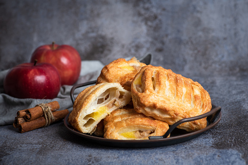 Two pieces of apple strudel decorated, serve on a plate