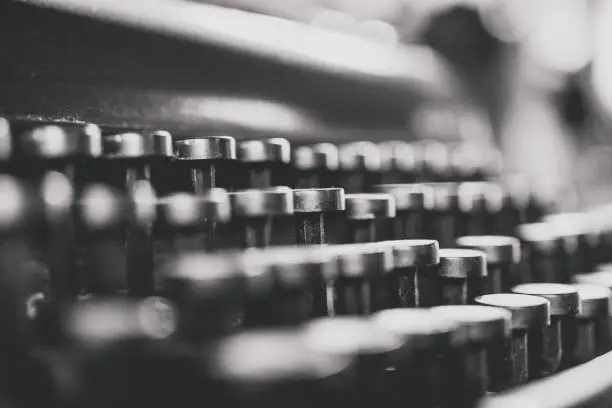Photo of Vintage typewriter keys for typing. Close up.