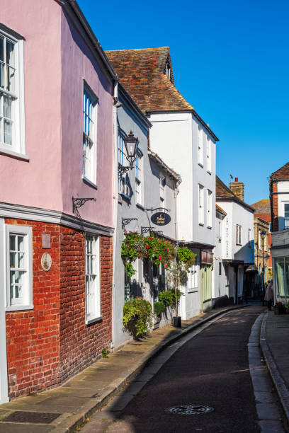 Pretty bright coloured buildings in Sandwich, Kent, UK Sandwich, UK - Oct 28 2021 Pretty bright coloured buildings on a fine autumn day in the historic town of Sandwich, Kent. sandwich kent stock pictures, royalty-free photos & images