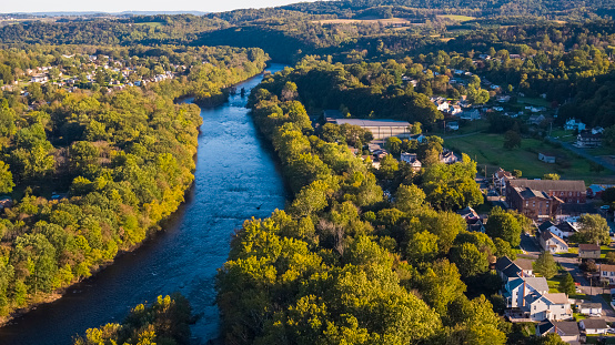 Aerial scenic view of the small American town Slatington lying along with the Lehigh River and historical Lehigh Chanel used for coal transportation, Lehigh Valley, Pennsylvania, USA, on a sunny evening in the early autumn.