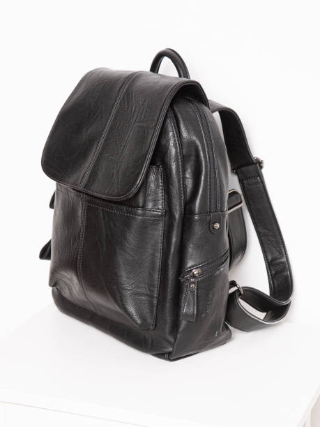 istock Black backpack bag with straps with zippers. bag for things, accessories and textbooks is in interior of apartment. 1350078953