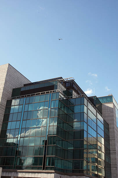 istock Helicopter above modern glass building 135008075