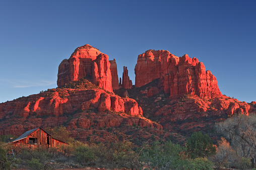 Cathedral Rock and a cabin near Sedona, Arizona.