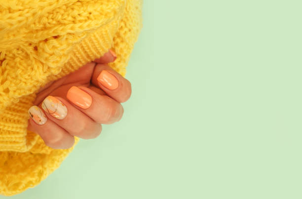 istock female hand with beautiful manicure cloth 1350082558
