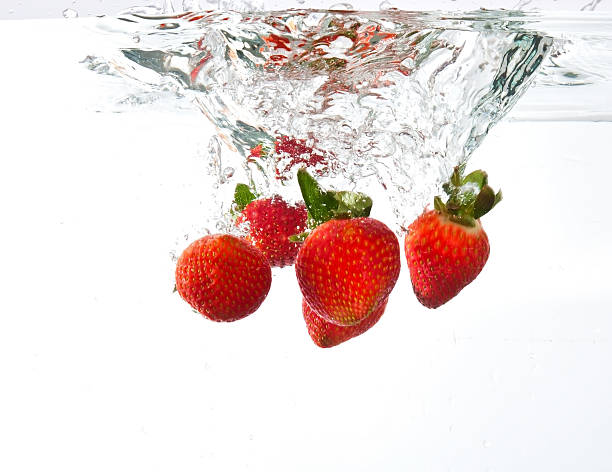 istock Strawberries dropped into water splash 135008353