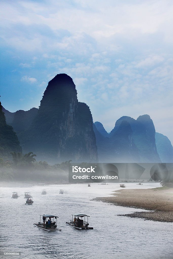 Rafting on Li River, Guilin, China Captured in Yangshou, Guilin, China. This kind of boat is a common kind of transportation on Li River. River and Mountain landscapes in Guilin is named the best in China. Adventure Stock Photo