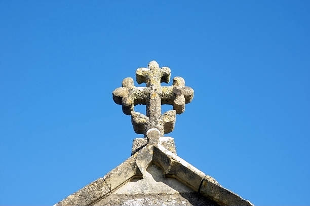 istock Celtic cross on church blue sky 135008684