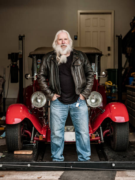 istock Senior man posing by his vintage car 1350092355