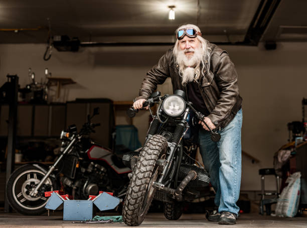 istock Senior man working on his motorcycle 1350092373
