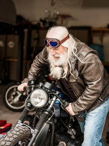 istock Senior man working on his motorcycle 1350092374