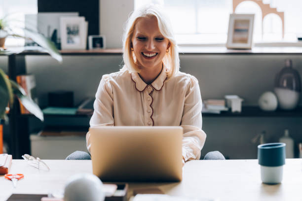 istock Young Business Woman Using Laptop Computer at Home 1350092757