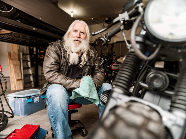 istock Senior man working on his motorcycle 1350094559