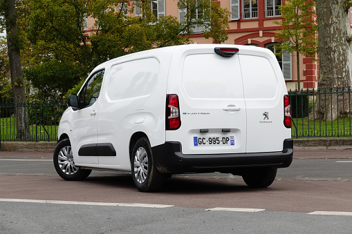 Paris, France - 22 October, 2021: Electric delivery van Peugeot e-Partner on a street. This model is the smallest full electric delivery van from Peugeot brand.