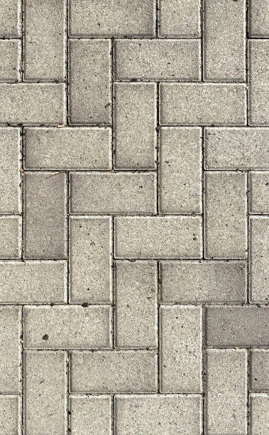 istock decorative stone carved paver stones cobblestone street road path driveway pattern overhead vertical background 1350099066