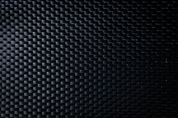 istock Mesh black texture. Dark polyester fiber material for sport cloth or abstract weave background. Synthetic pattern for backpacks and sports equipment. 1350100361