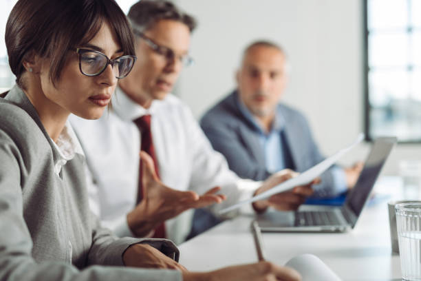 istock Businesswoman taking notes on a meeting in the office 1350101256