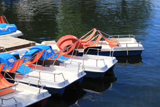 A boat capsized (overturned) in the middle of the sea. Copy space on left.