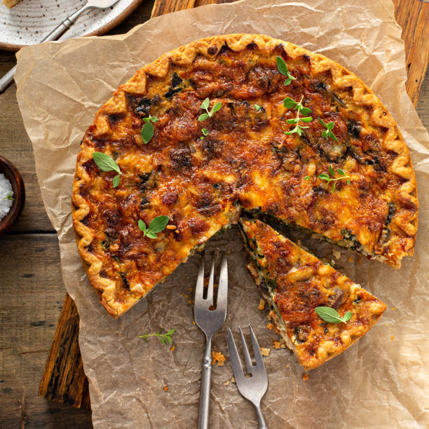 istock Bacon, mushroom and spinach quiche with cheese and herbs 1350102739