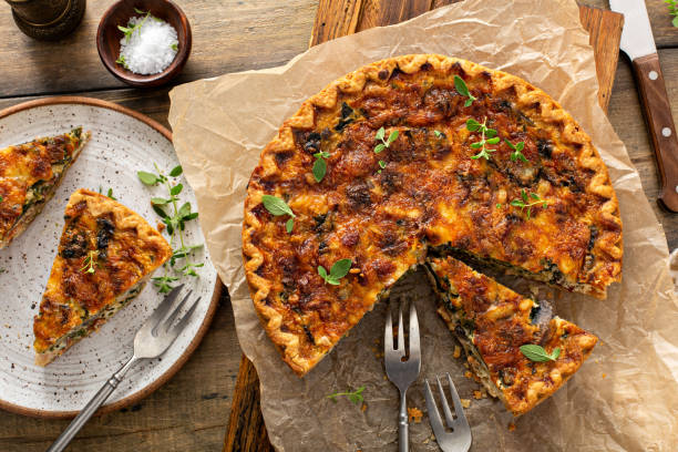 istock Bacon, mushroom and spinach quiche with cheese and herbs 1350102750