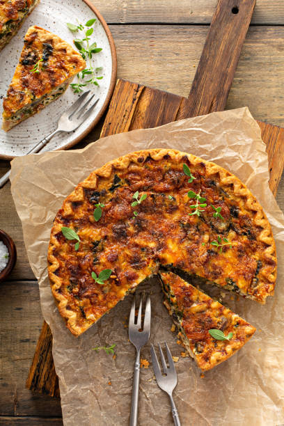istock Bacon, mushroom and spinach quiche with cheese and herbs 1350102757