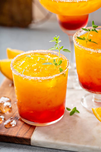 istock Tequila sunrise margarita cocktail with ice, refreshing drink 1350102781