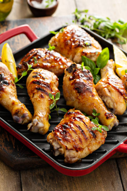 istock Grilled chicken thighs and drumsticks with honey glaze 1350102817