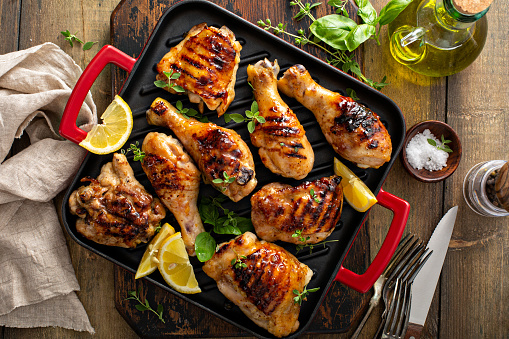 Grilled chicken thighs and drumsticks with sweet honey glaze