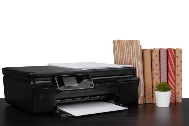 istock Office table with laser printer and books against white background 1350103664