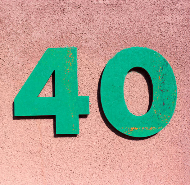 istock Green Number 40 Street Address on Adobe Wall 1350107509