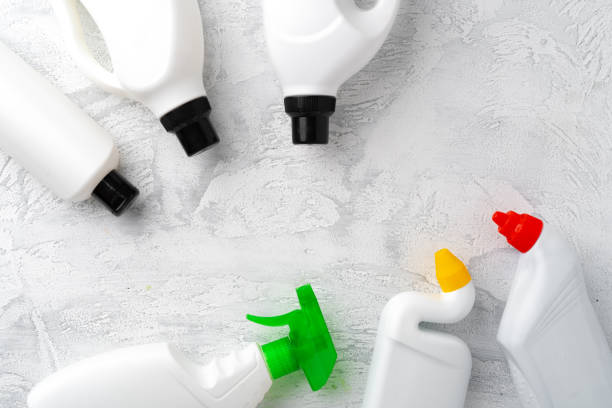 istock Set of different bottles of detergents top view on grey background 1350107555