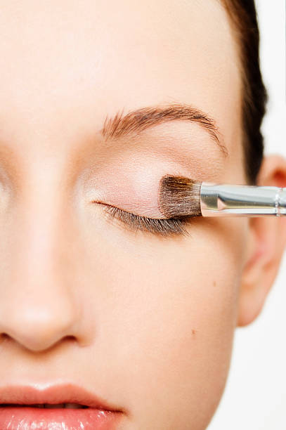 istock Woman applying a pale pink eyeshadow 135010993