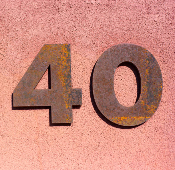 istock Rusty Number 40 Street Address on Adobe Wall 1350115778