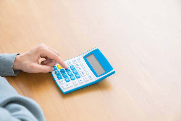 istock Woman  having an electronic calculator,hands 1350118122