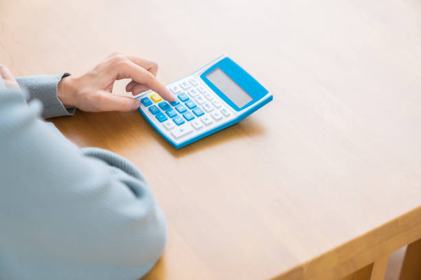 istock Woman  having an electronic calculator,hands 1350118749