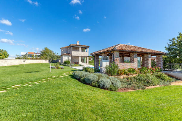 istock Luxurious beautiful modern villa with swimming pool and yard garden 1350120209