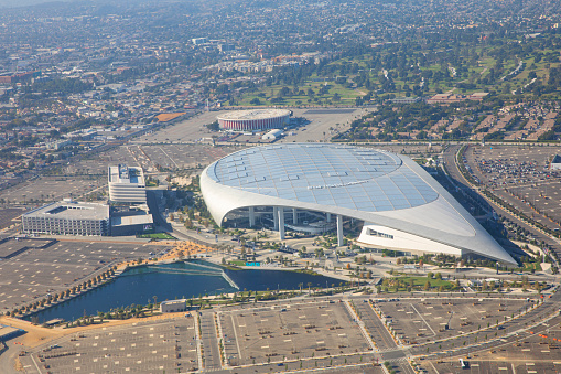 Los Angeles, California USA, September 2021- Aerial view of the So-Fi stadium in Los Angeles, And behind it, a view of the Forum.  The SoFi is an entertainment complex located in Inglewood, Los Angeles. Airplane window viewpoint.