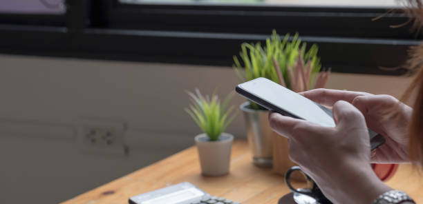 istock Close up hand of woman using smartphone, texting text message, hipster touch screen on smartphone light bokeh, girls using in hands cellphone close up, online internet. 1350129890
